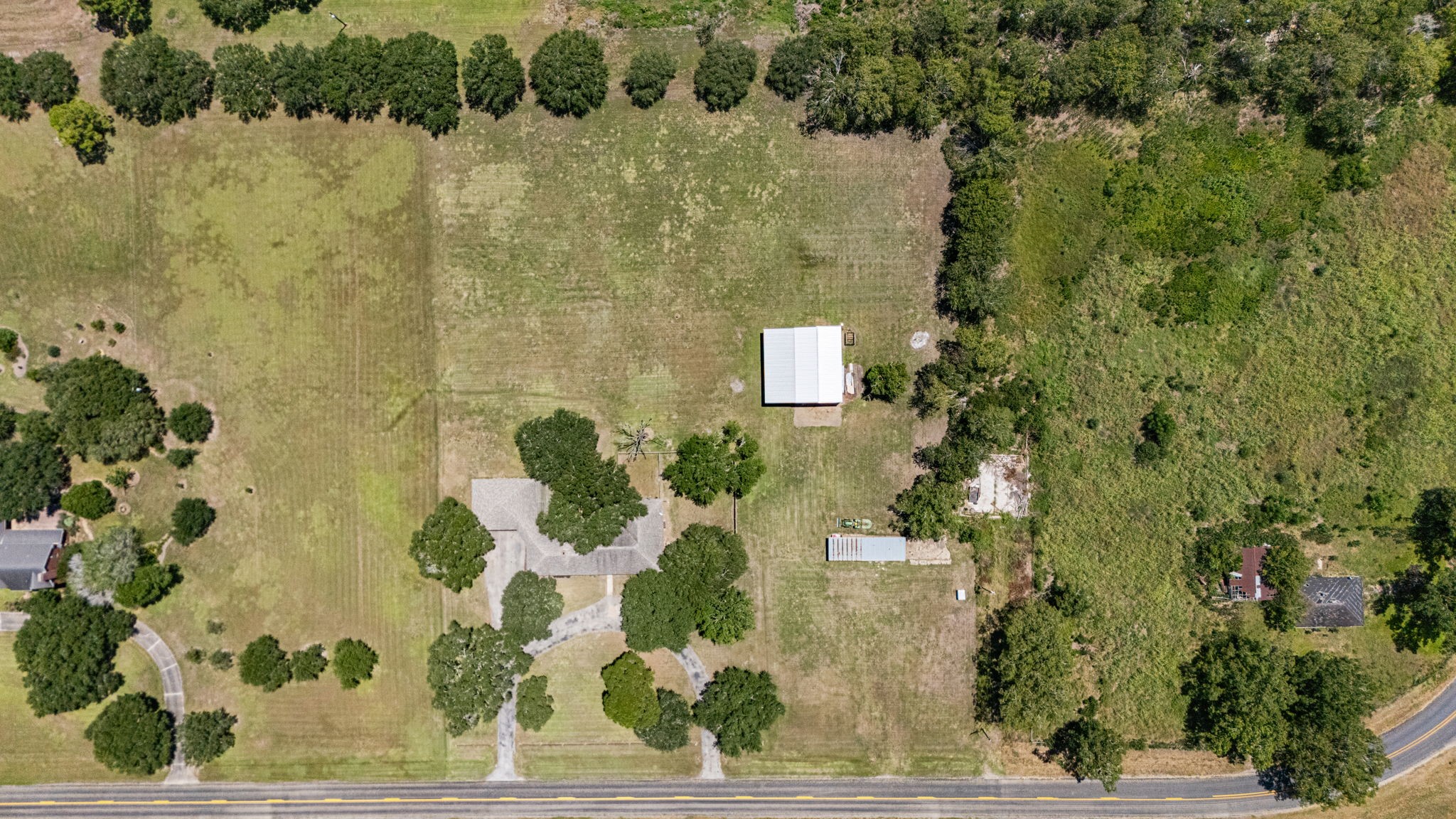 3148 FM 333 Road Garwood, TX 77442 - Photo 38 of 50 a bathroom with a shower and a mirror