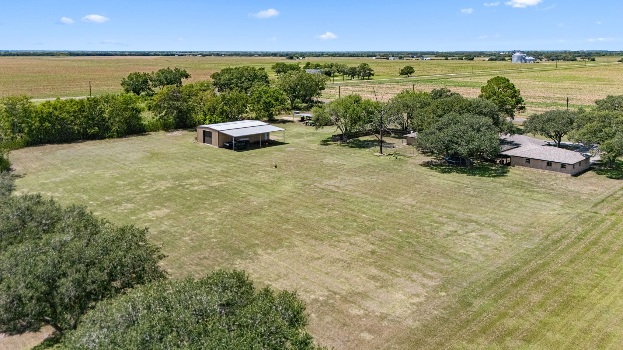 3148 FM 333 Road Garwood, TX 77442 - Photo 40 of 50 a view of a lake with houses in the back