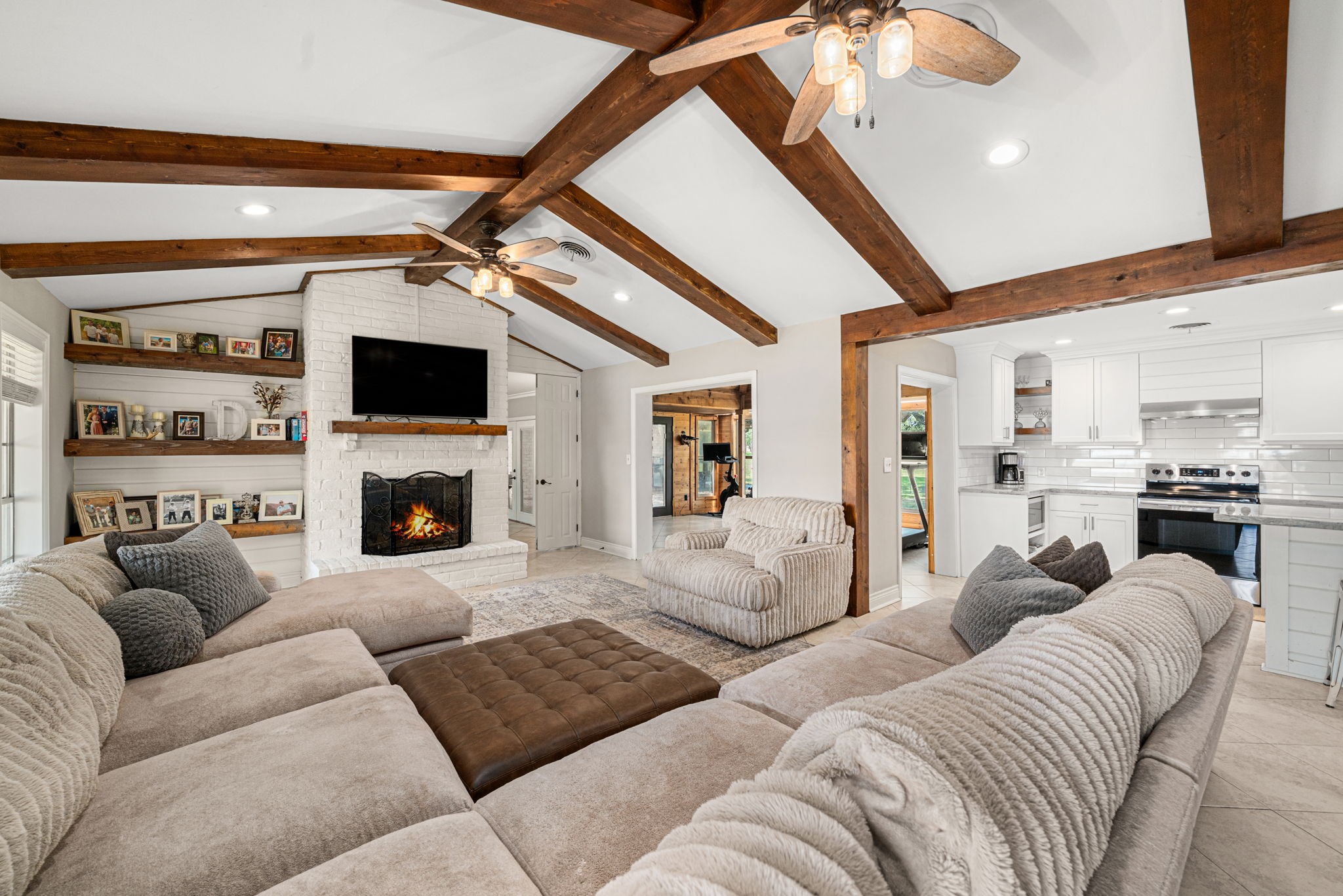3148 FM 333 Road Garwood, TX 77442 - Photo 9 of 50 a living room with furniture a fireplace and a flat screen tv