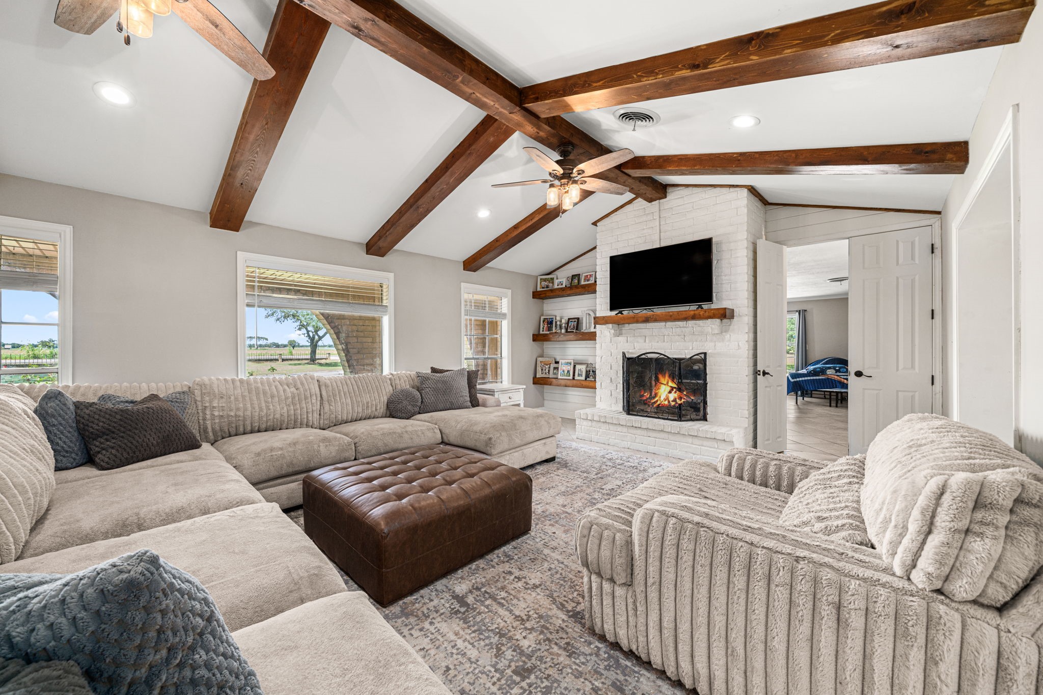 3148 FM 333 Road Garwood, TX 77442 - Photo 10 of 50 a living room with furniture fireplace and a flat screen tv
