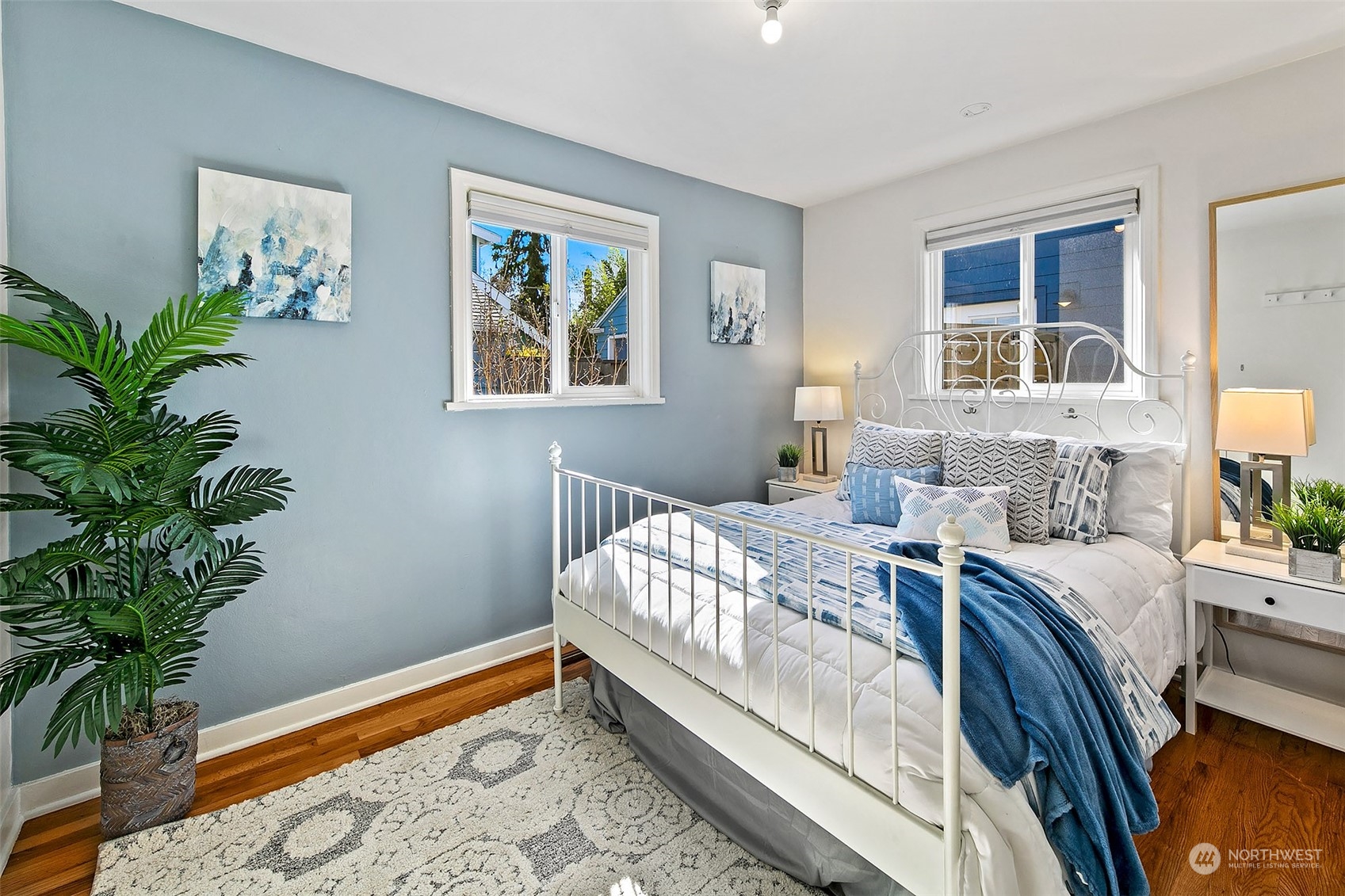 4415 Eastern Avenue North Seattle, WA 98103 - Photo 12 of 27 a bedroom with a bed and a potted plant