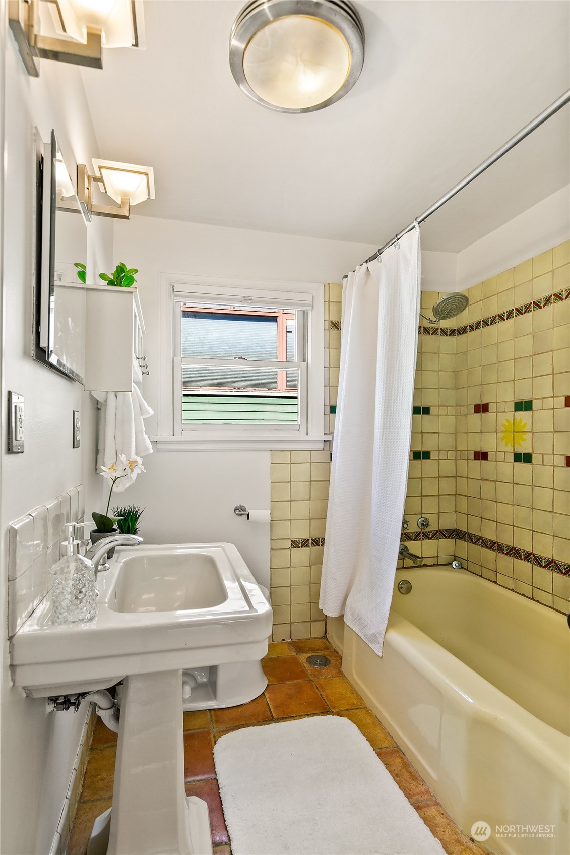 4415 Eastern Avenue North Seattle, WA 98103 - Photo 13 of 27 a bathroom with a sink a toilet and shower