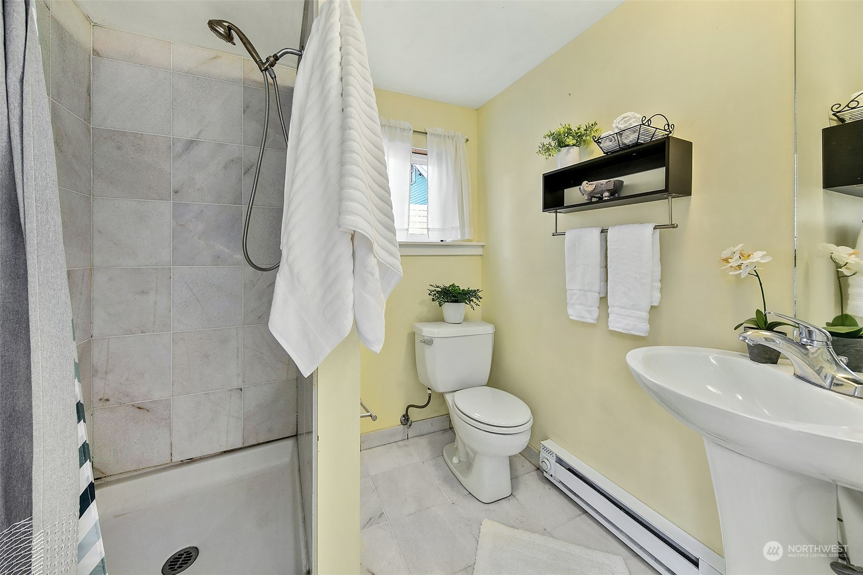 4415 Eastern Avenue North Seattle, WA 98103 - Photo 19 of 27 a bathroom with a sink toilet and shower