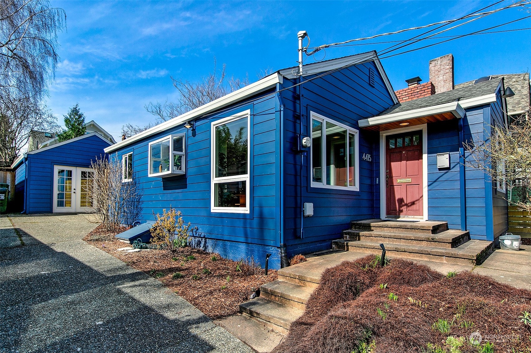 4415 Eastern Avenue North Seattle, WA 98103 - Photo 2 of 27 a view of a brick house with many windows