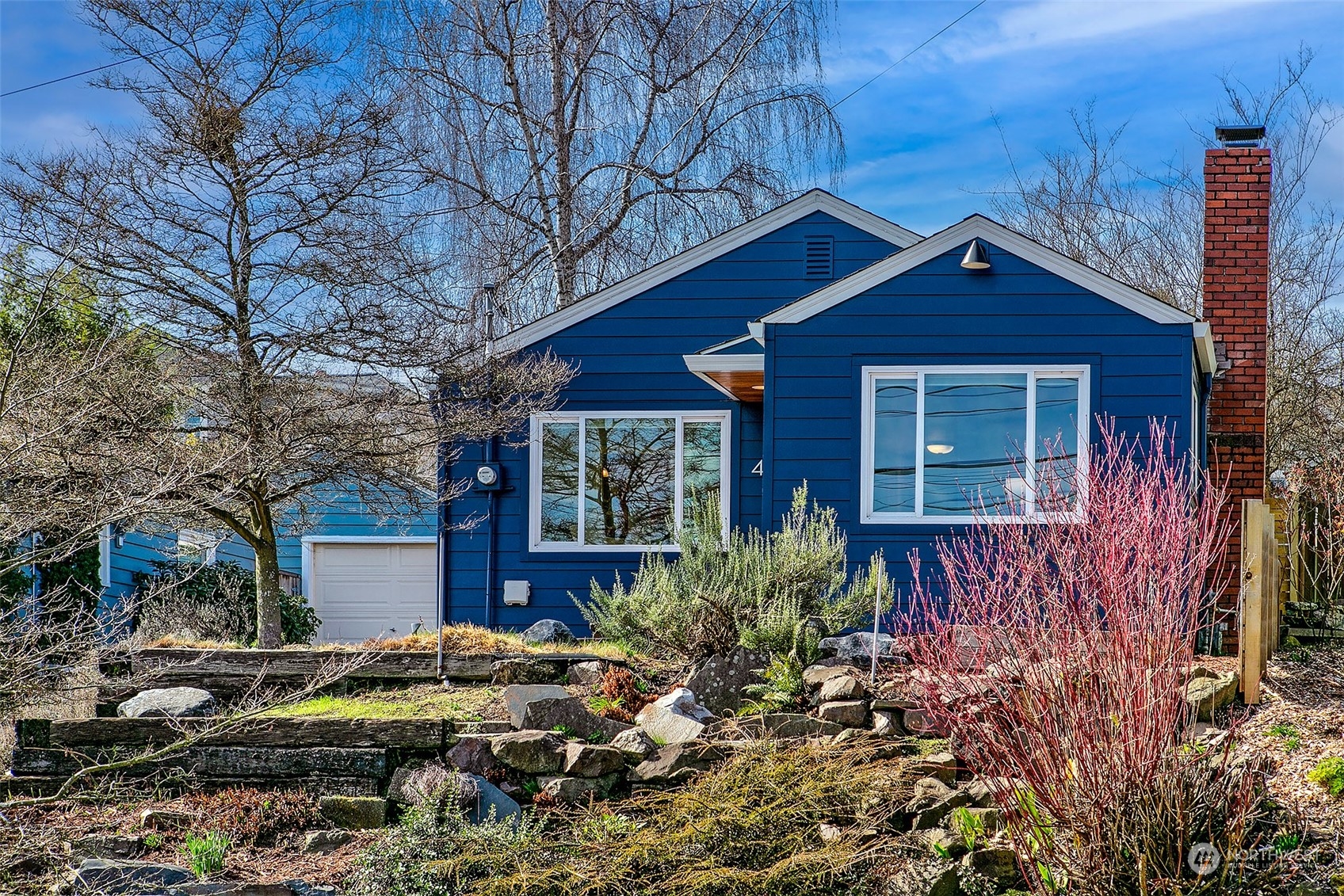 4415 Eastern Avenue North Seattle, WA 98103 - Photo 3 of 27 a view of a house with wooden fence