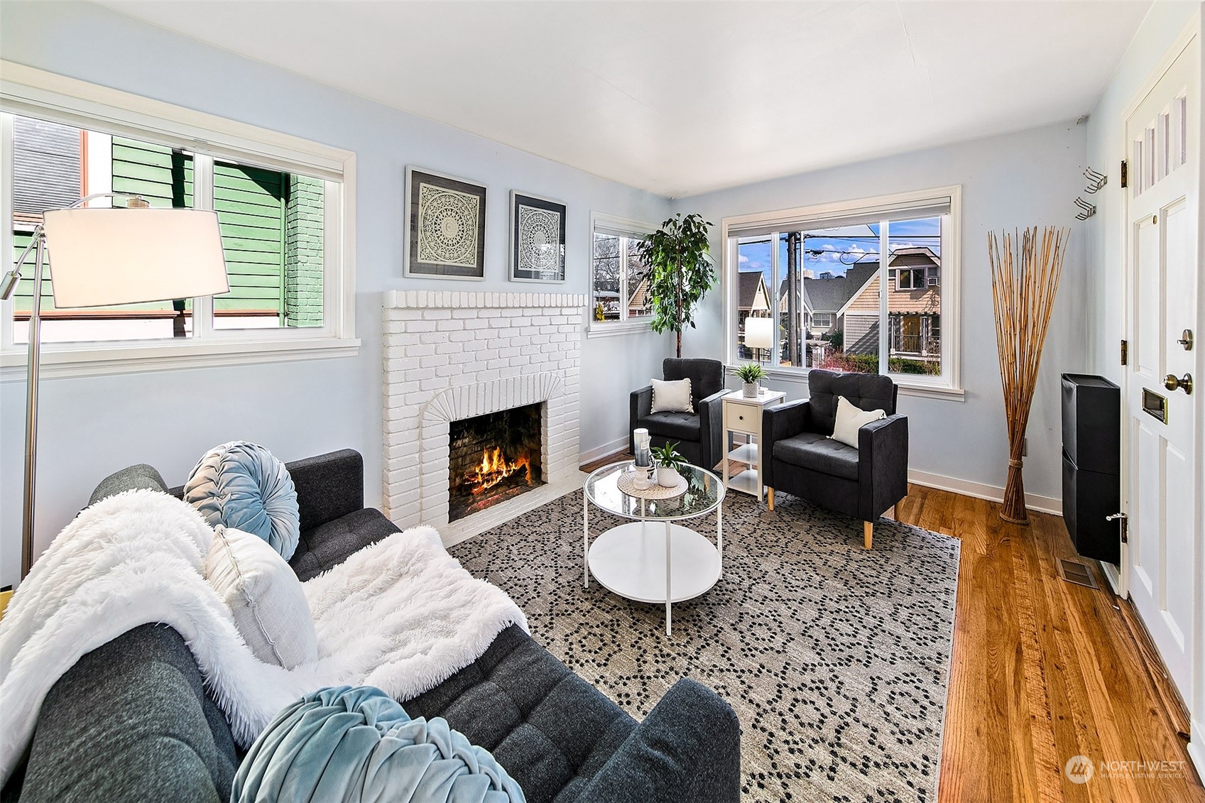 4415 Eastern Avenue North Seattle, WA 98103 - Photo 4 of 27 a living room with furniture fireplace and a table
