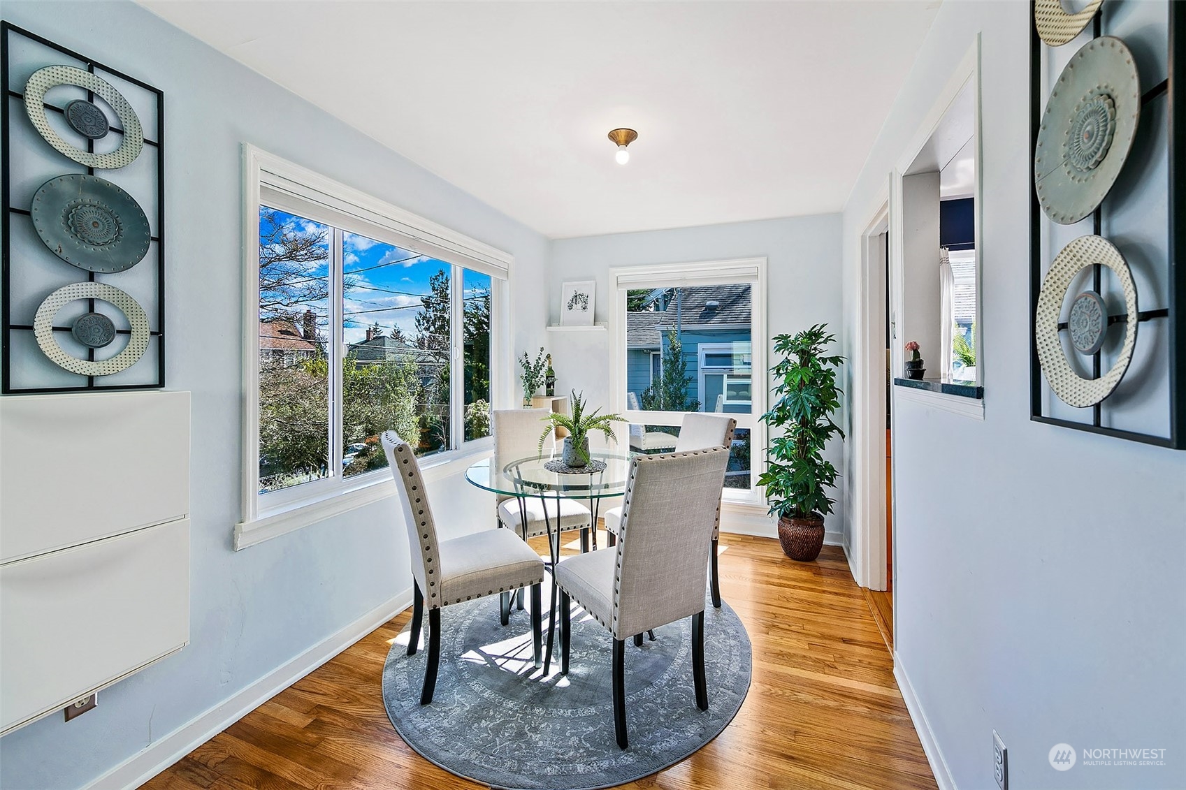 4415 Eastern Avenue North Seattle, WA 98103 - Photo 7 of 27 a view of a dining room with furniture window and wooden floor
