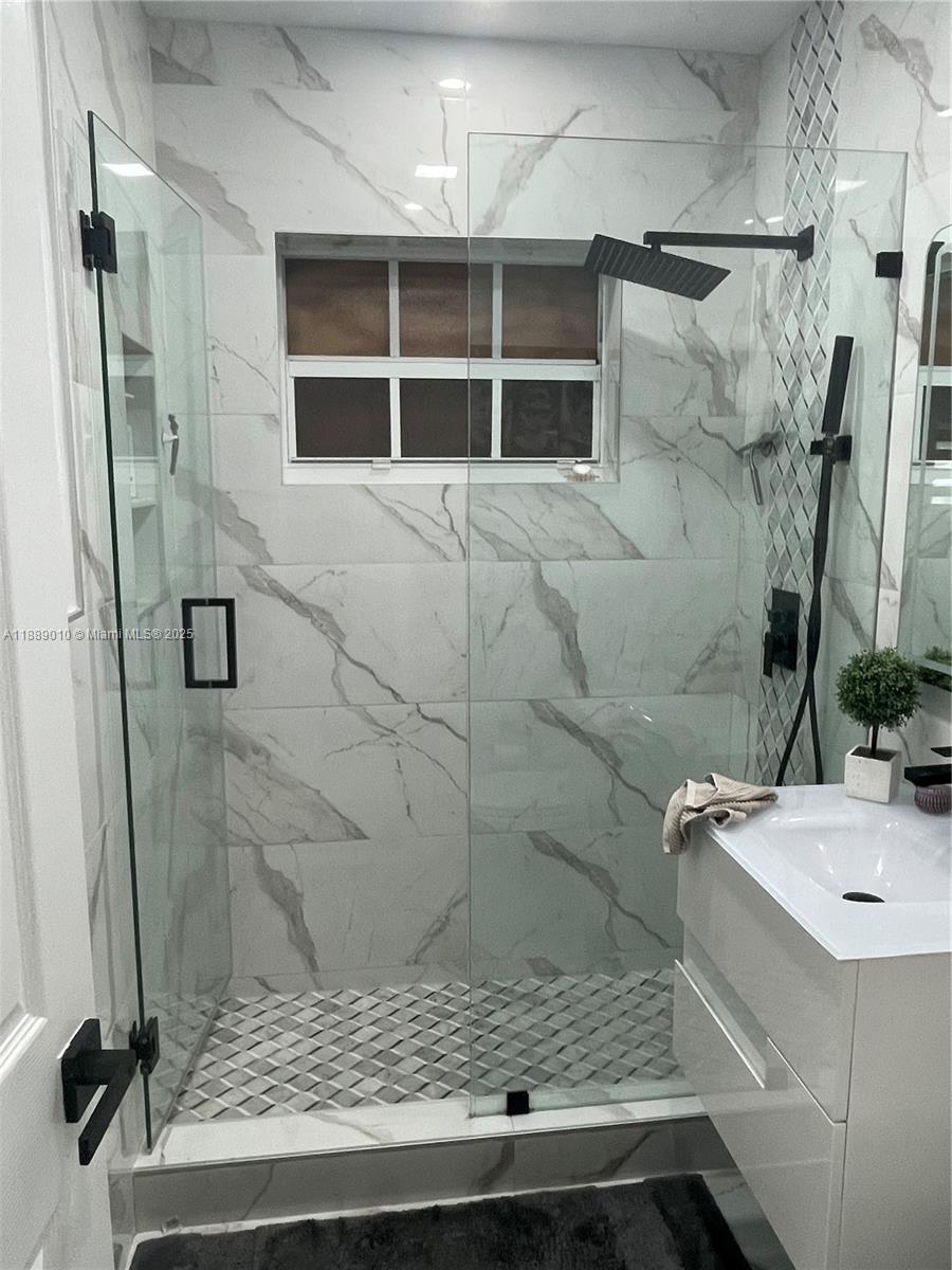 390 East 53rd Street Hialeah, FL 33013 - Photo 12 of 21 a bathroom with a sink and a shower