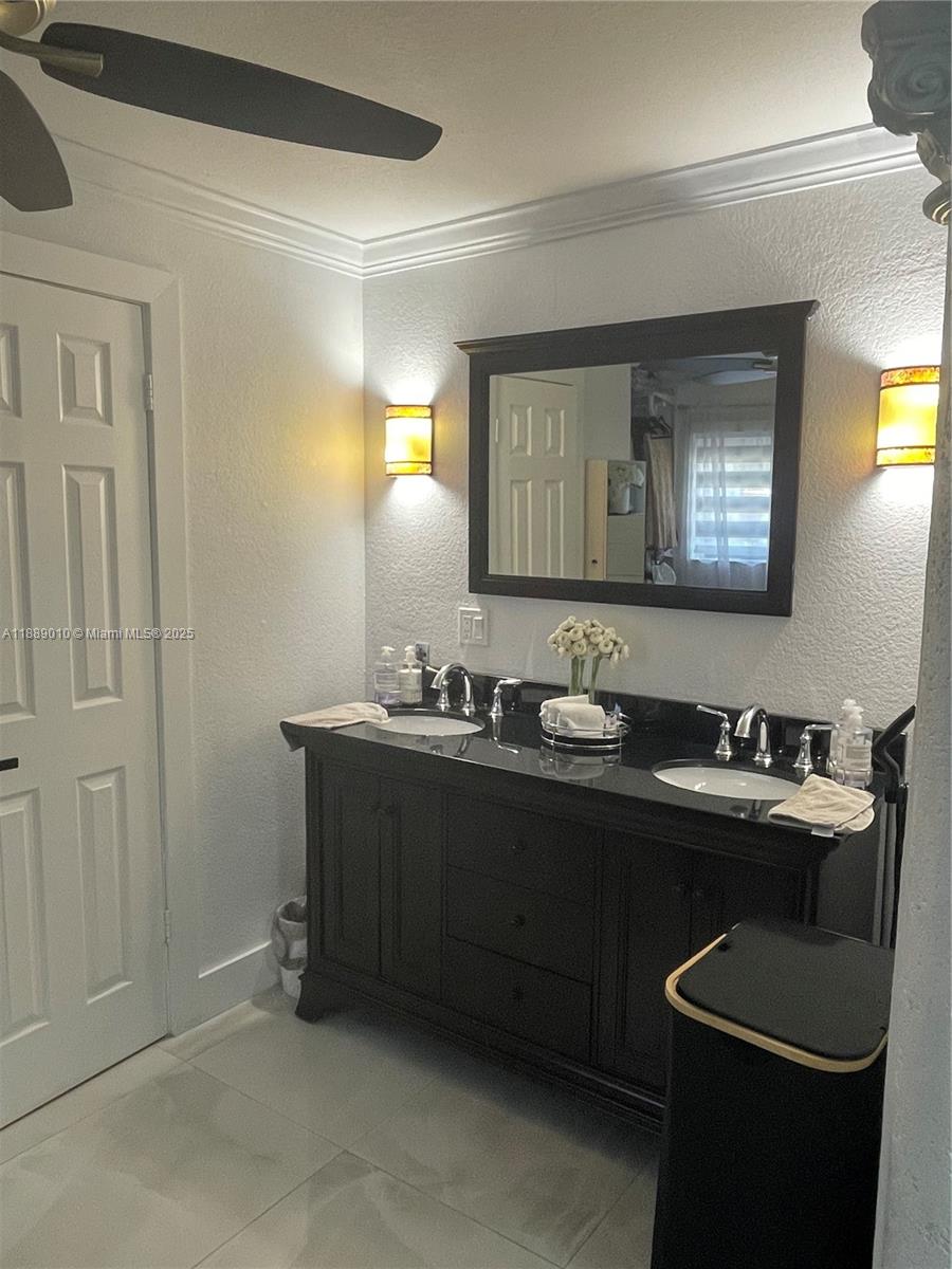 390 East 53rd Street Hialeah, FL 33013 - Photo 14 of 21 a bathroom with a sink and a mirror