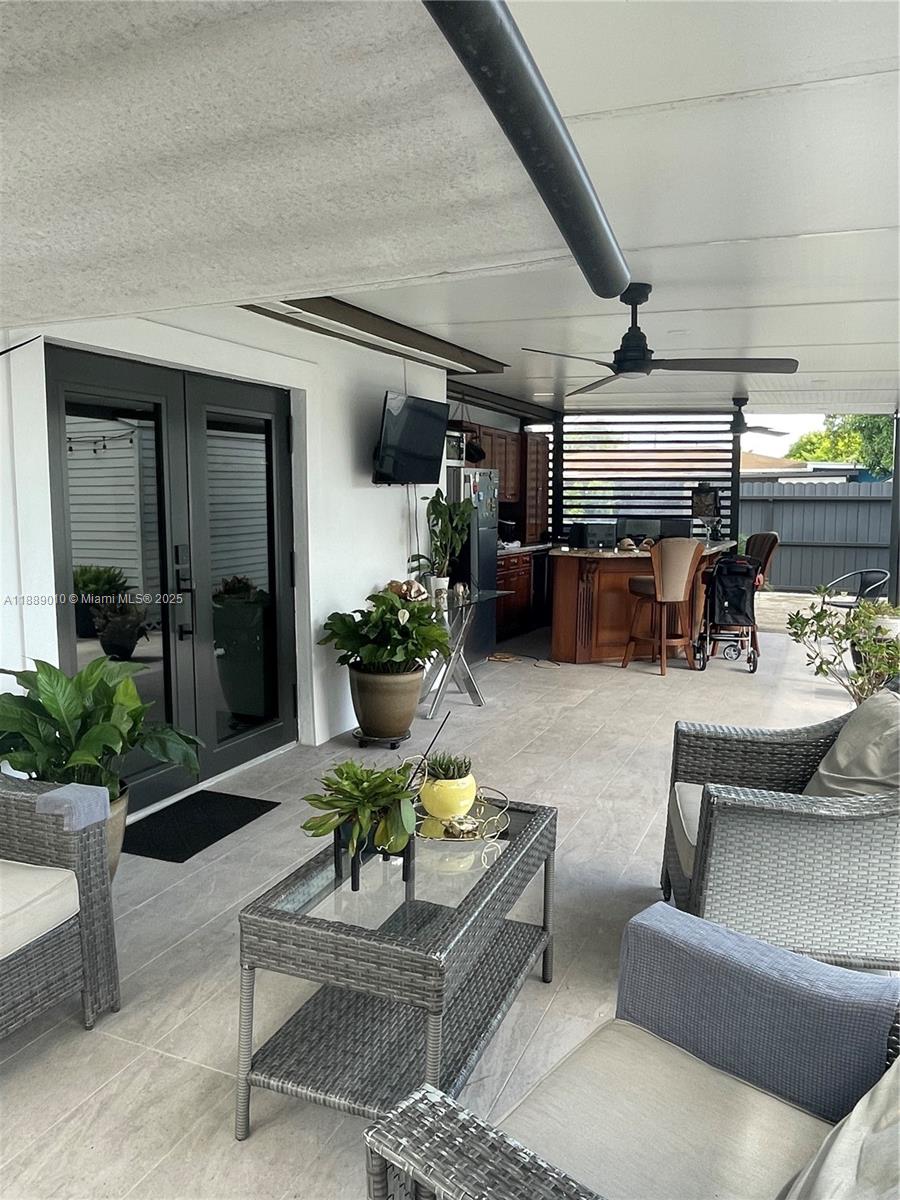 390 East 53rd Street Hialeah, FL 33013 - Photo 15 of 21 a living room with furniture and a potted plant