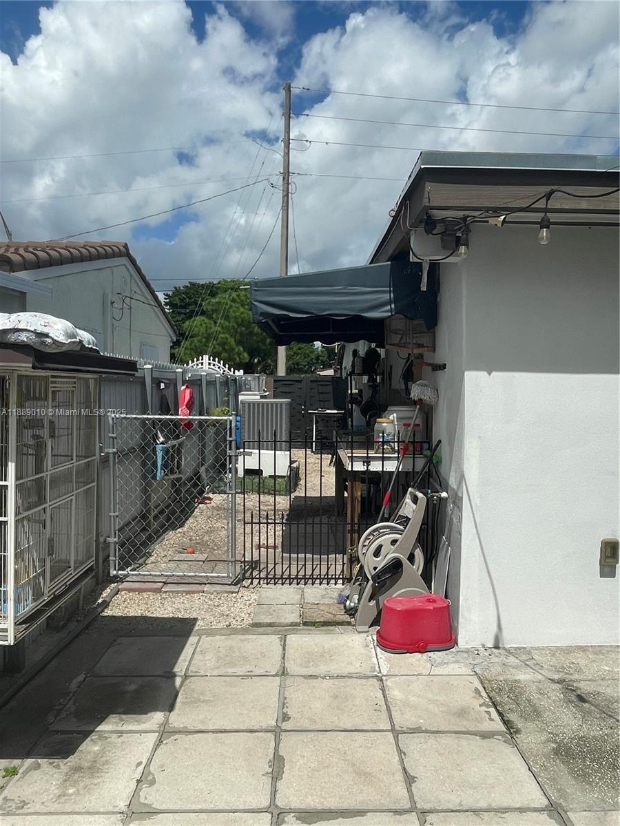 390 East 53rd Street Hialeah, FL 33013 - Photo 16 of 21 a view of a patio with table and chairs potted plants