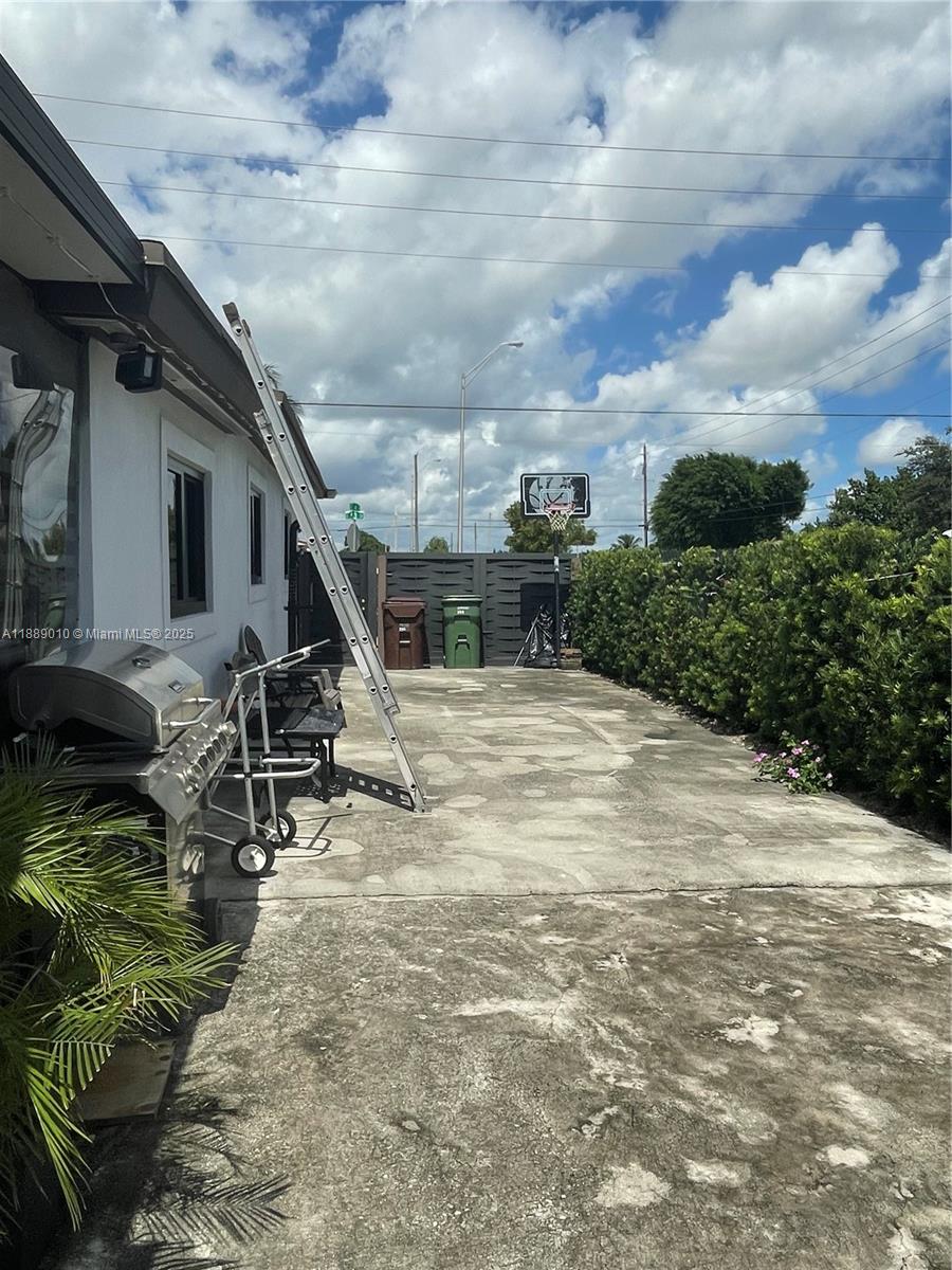 390 East 53rd Street Hialeah, FL 33013 - Photo 18 of 21 a view of a backyard with sitting area