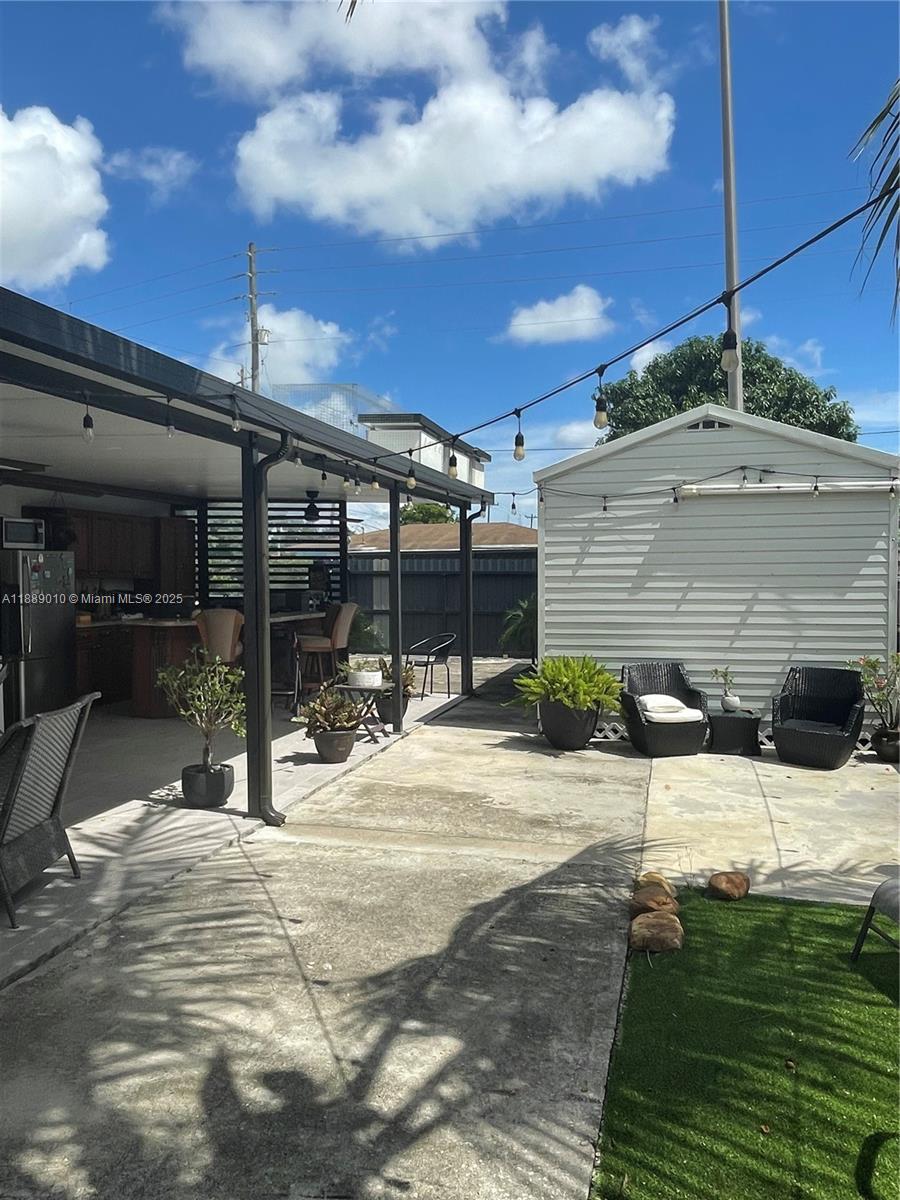 390 East 53rd Street Hialeah, FL 33013 - Photo 20 of 21 a view of a building with a patio