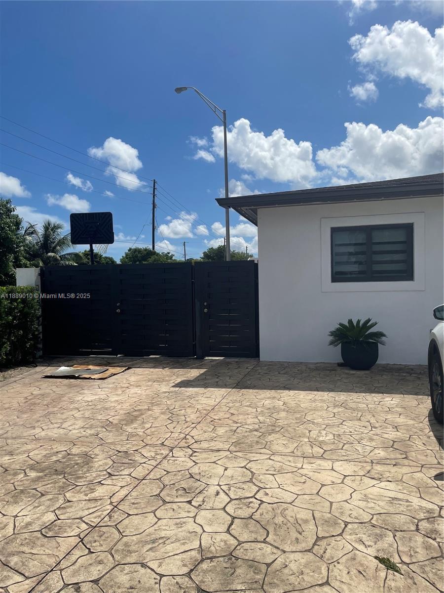390 East 53rd Street Hialeah, FL 33013 - Photo 3 of 21 a view of a livingroom with a barbeque