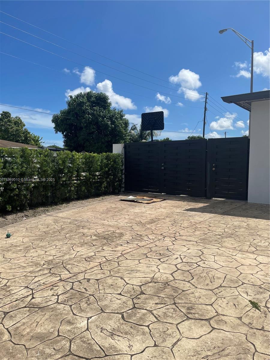 390 East 53rd Street Hialeah, FL 33013 - Photo 4 of 21 a view of a backyard of the house