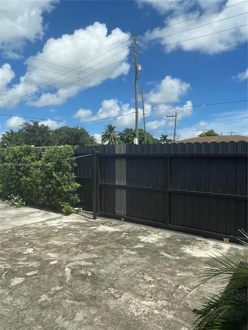 a view of a backyard of the house