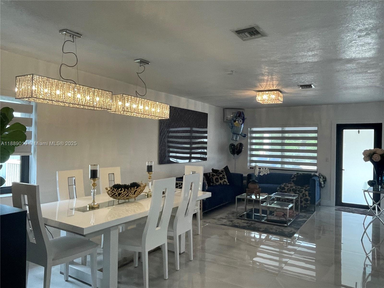 390 East 53rd Street Hialeah, FL 33013 - Photo 9 of 21 a dining room with furniture and window