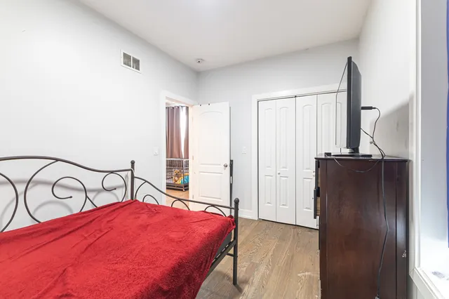 a bedroom with a bed and a table