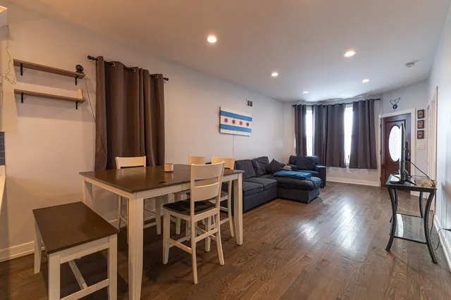 a view of a livingroom with furniture and a window