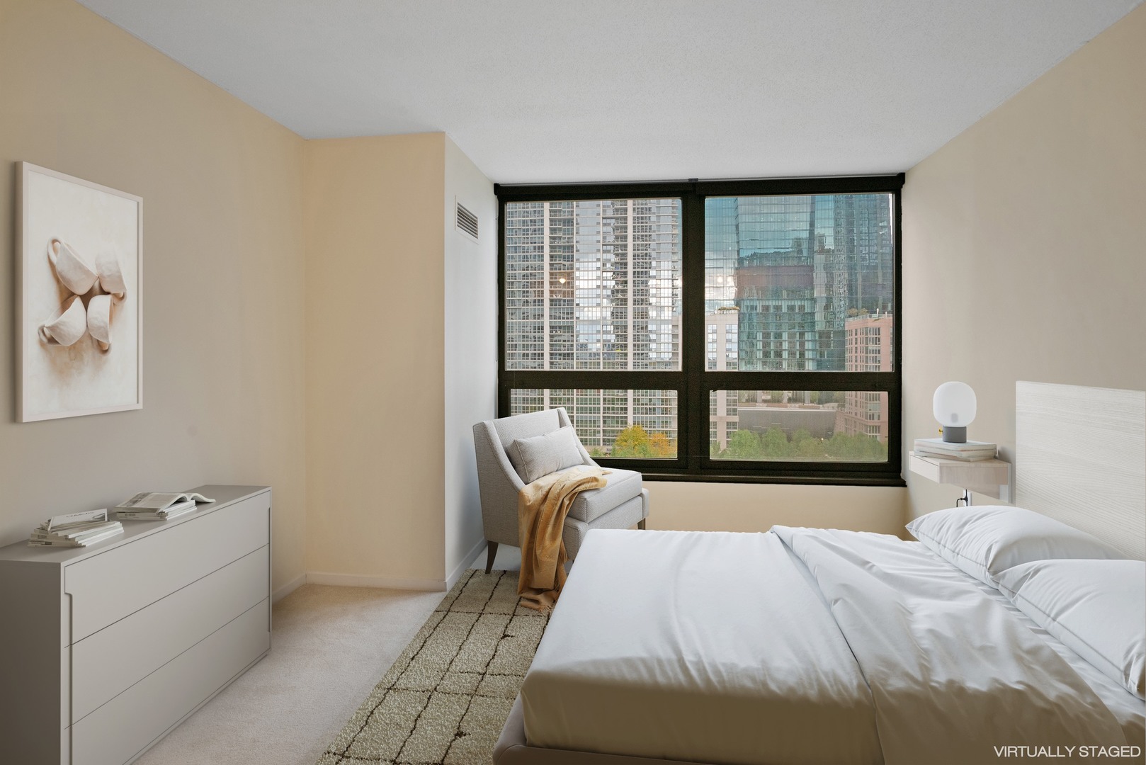 360 East Randolph Street, Unit 707 Chicago, IL 60601 - Photo 12 of 20 a bedroom with a bed and a large window