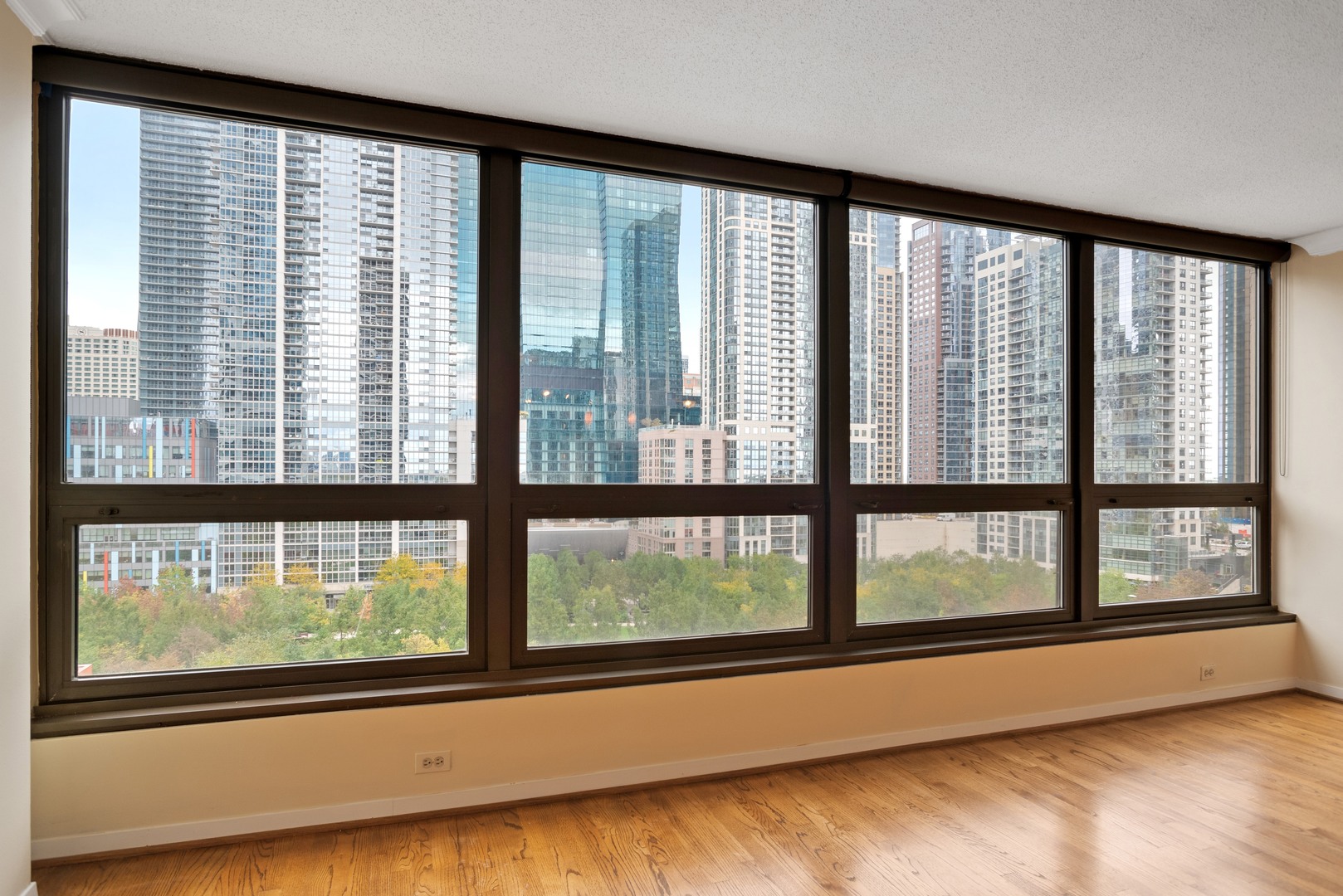 360 East Randolph Street, Unit 707 Chicago, IL 60601 - Photo 6 of 20 a view of empty room with large windows
