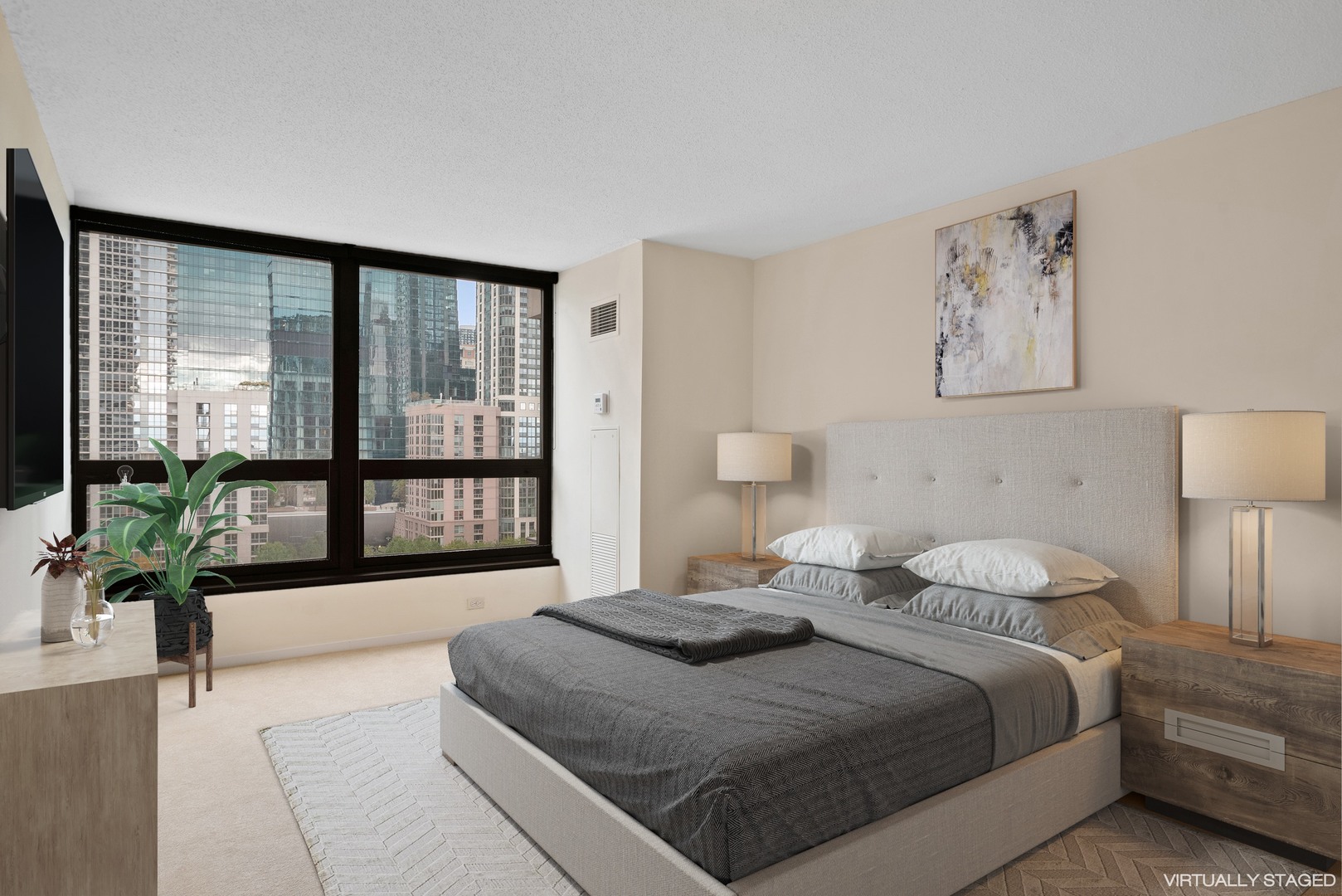 360 East Randolph Street, Unit 707 Chicago, IL 60601 - Photo 9 of 20 a bedroom with a large bed and a large window