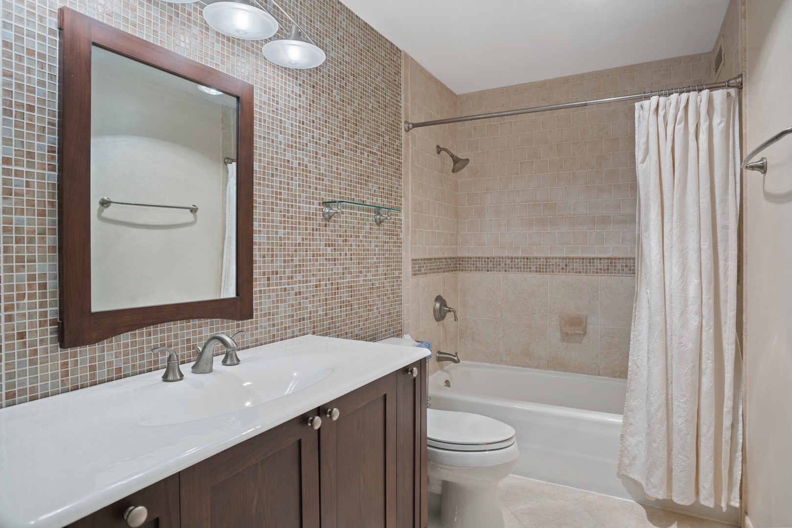 360 East Randolph Street, Unit 707 Chicago, IL 60601 - Photo 10 of 20 a bathroom with a sink a toilet and shower