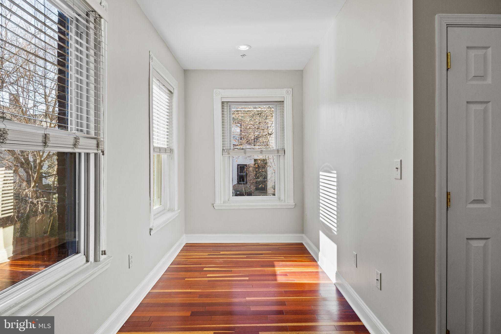 426 South 44th Street, Unit 2 Philadelphia, PA 19104 - Photo 19 of 31 a view of a hallway with wooden floor and a window