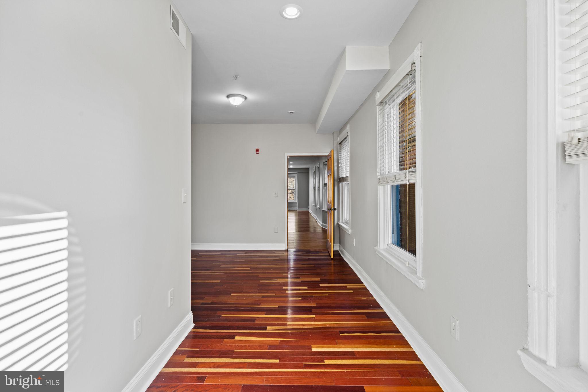 426 South 44th Street, Unit 2 Philadelphia, PA 19104 - Photo 20 of 31 a view of a hallway with wooden floor and staircase