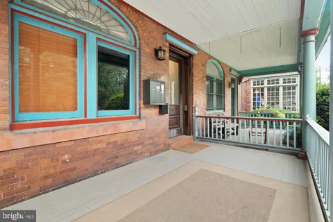 swimming pool view with a garden