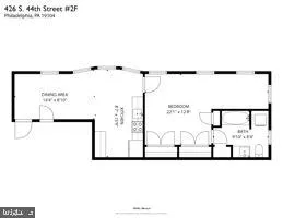 a picture of a bench in front of a gate