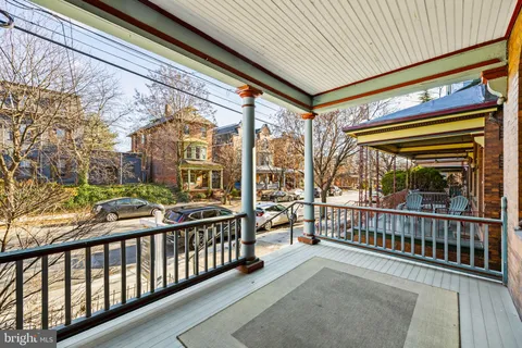 a view of a porch with wooden floor