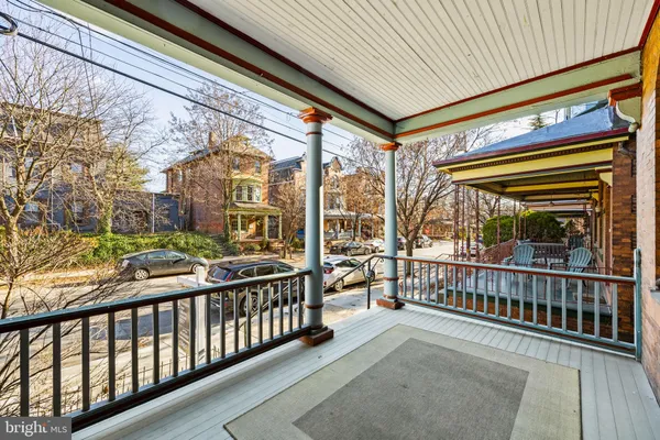 a view of a porch with wooden floor