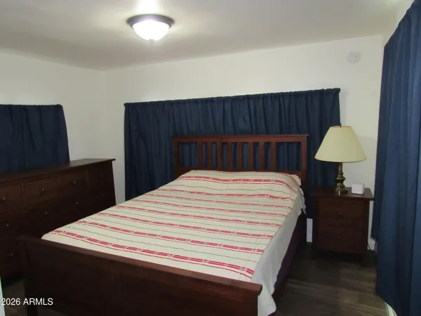 a bed room with a bed and a mirror