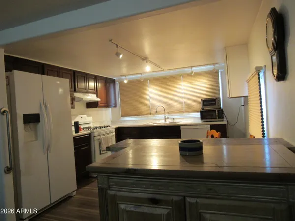 a kitchen with a table and chairs in it