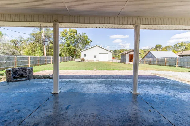 a view of a house with a backyard