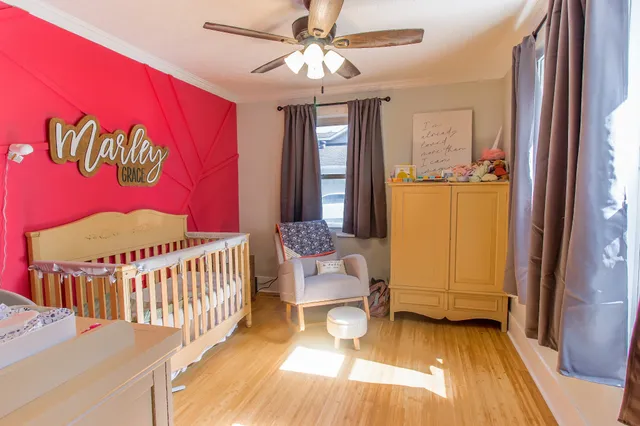 a bedroom with furniture and a window