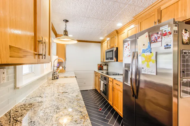 a view of a very nice looking living room with a large window