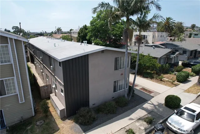 a utility room with multiple dryer and washer