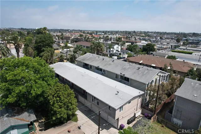 an aerial view of a residential apartment building with a yard