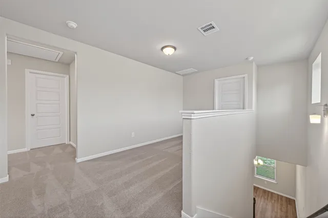 an empty room with closet area