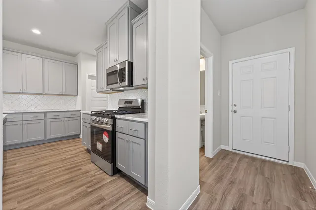 a bathroom with a toilet and a vanity