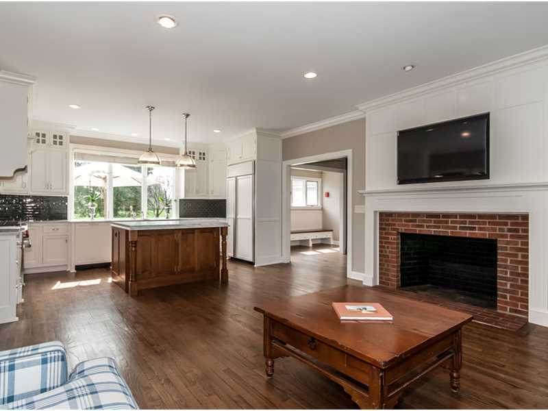45 Cedar Cliff Road Riverside, CT 06878 - Photo 9 of 24 a living room with furniture a flat screen tv and a fireplace