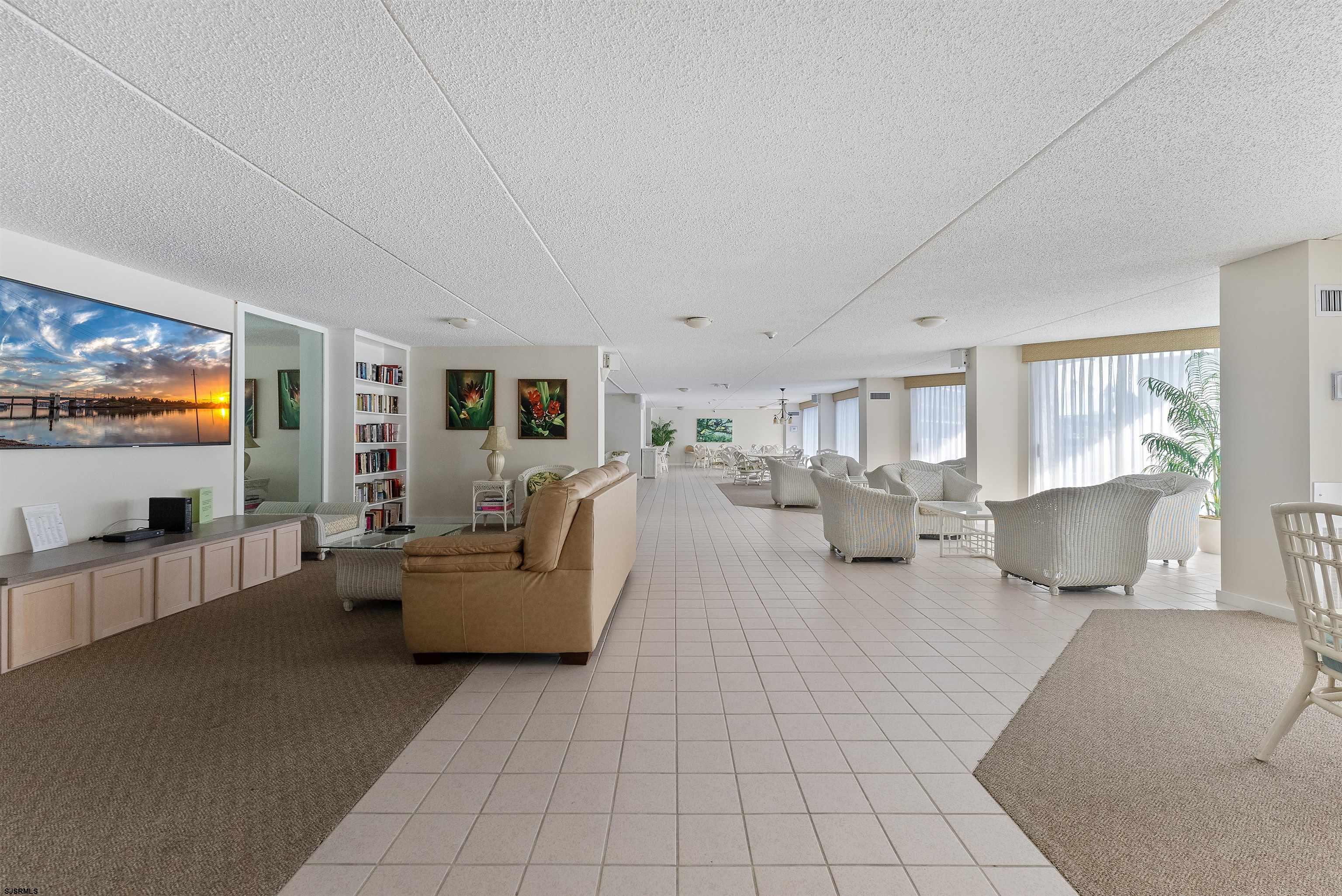 935 Ocean Avenue, Unit 319 Ocean City, NJ 08226 - Photo 15 of 24 a living room with furniture and a flat screen tv