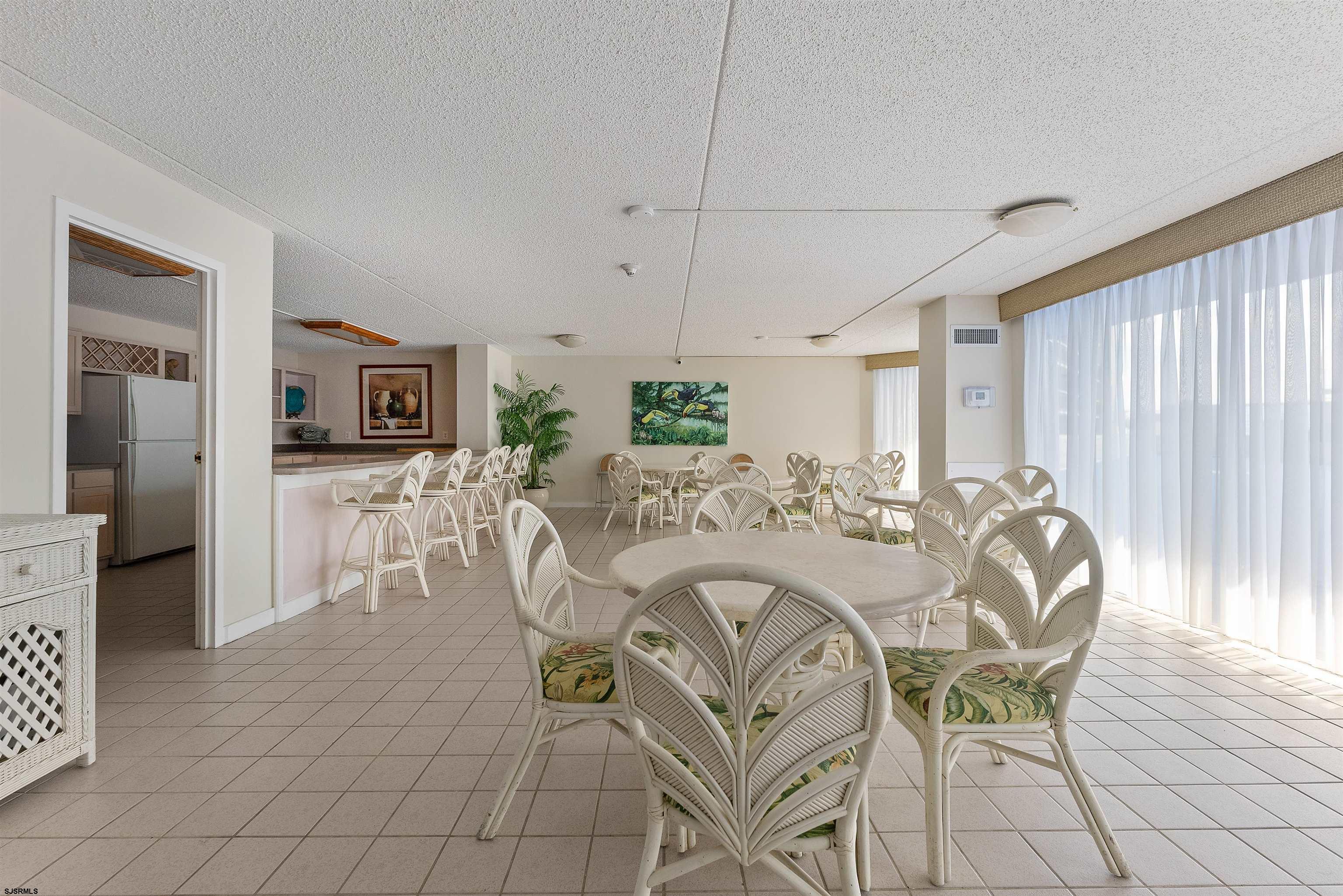 935 Ocean Avenue, Unit 319 Ocean City, NJ 08226 - Photo 18 of 24 a view of a dining room with furniture