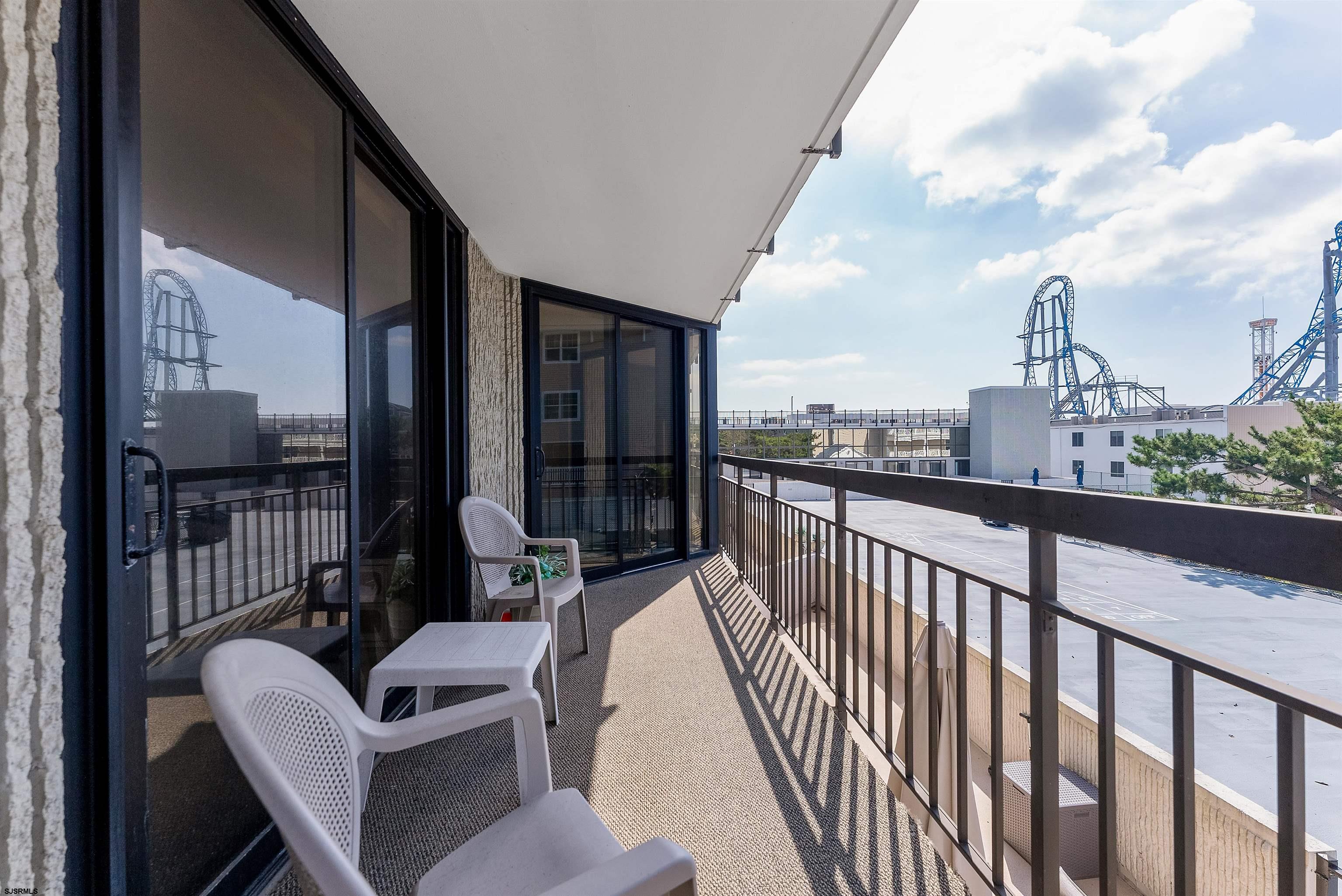 935 Ocean Avenue, Unit 319 Ocean City, NJ 08226 - Photo 8 of 24 a view of a chairs in balcony