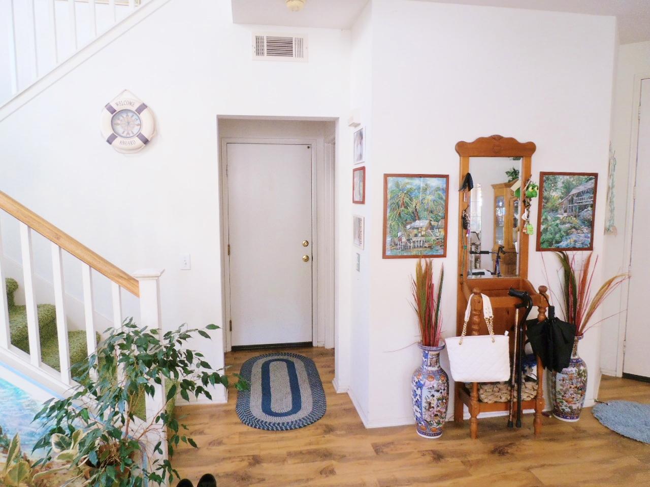 2307 Mint Way Oxnard, CA 93036 - Photo 13 of 39 a view of entryway and hall with wooden floor