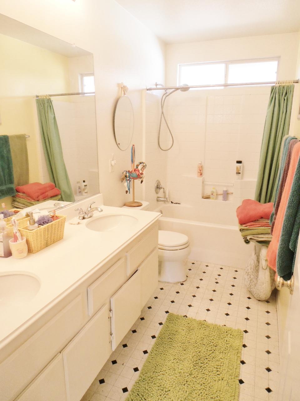2307 Mint Way Oxnard, CA 93036 - Photo 32 of 39 a bathroom with a sink mirror vanity and toilet