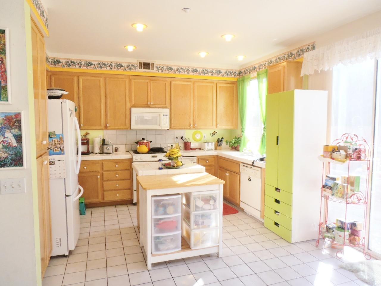 2307 Mint Way Oxnard, CA 93036 - Photo 9 of 39 a kitchen with appliances cabinets and a counter top space