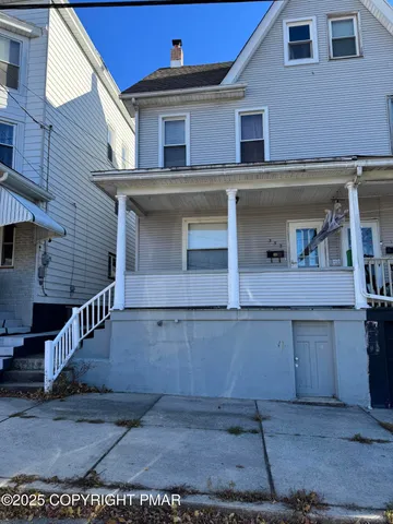 a view of a house with a garage